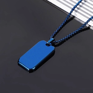 Macro shot of blue stainless steel rectangle pendant with glossy mirror finish