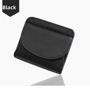Detail view of black lychee-grain leather wallet showing premium stitching and RFID protection