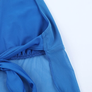 Macro view of blue halter top details with sheer mesh fabric and strappy ties