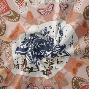 Detail of silk-like tapestry fabric showing bohemian butterfly patterns and deer head motif