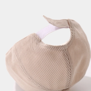 Detail of khaki corduroy child hat with adjustable velcro strap and premium texture