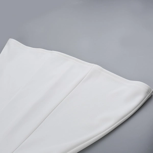 Detailed view of the fine stitching and smooth fabric on a white mini dress