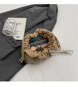 Internal view of khaki quilted chain bucket bag showing spacious storage for daily items