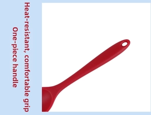 Detail of red silicone cooking spoon handle with heat-resistant and one-piece molded design