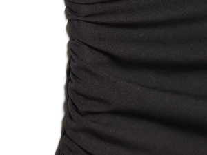 Close-up of black mesh dress fabric texture showing detailed pleated design and material