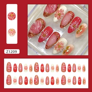 3D gold-lined camellia press-on nails with apricot marble texture and 30-piece set