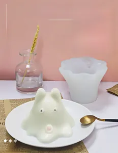 Detail of food grade silicone ghost mold with a finished cartoon jelly on a white plate