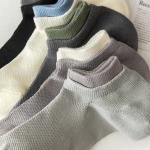 Set of men's low-cut cotton socks in diverse neutral colors with ribbed cuffs