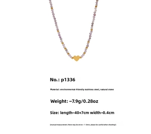Detail of lavender natural stone bead necklace with a gold stainless steel heart pendant
