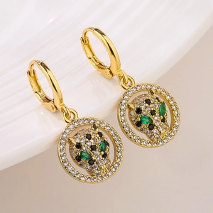 Gold leopard head earrings with sparkling crystals and green eyes in a circular frame