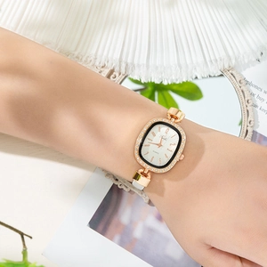 Detailed shot of luxury rose gold square watch for women with sparkling crystal bezel