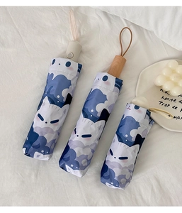 Detailed shot of cute cat cartoon folding umbrellas with matching protective storage sleeves