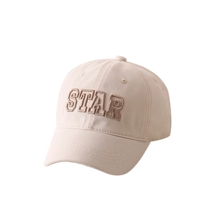 Close-up of beige cotton baseball cap featuring star embroidery and twill fabric texture