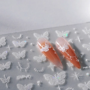 Exquisite 3D white butterfly nail art stickers with embossed pearls on gradient long nails
