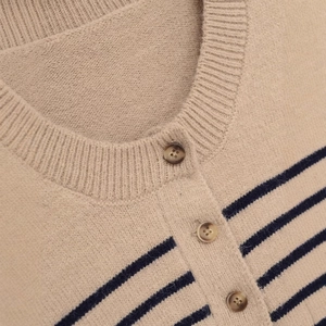 Women's crewneck striped knit sweater with amber-textured buttons in beige and navy