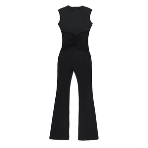 Detailed flat lay of black mesh patchwork jumpsuit featuring ruched waist and flared legs
