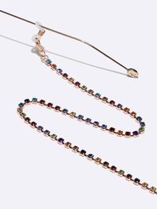 Macro shot of colorful rhinestone eyewear chain with rose gold clasp and non-slip rings
