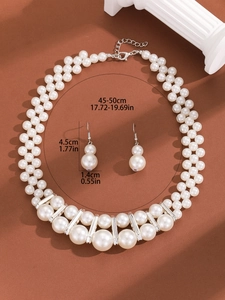 Macro shot of multi-layer pearl necklace and drop earrings with precise dimensions