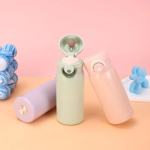 Three mini stainless steel vacuum flasks in pastel colors with pop-up lid details