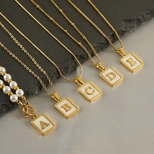 Golden stainless steel initial necklaces with white mother-of-pearl square pendants