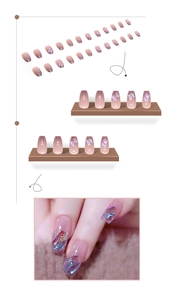 Detail of aurora shimmer coffin press-on nails with seashell fragments and glitter