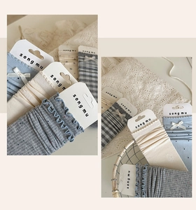 Detailed collage of knit cotton socks with bow ties and lace edges in blue and grey