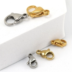 Detail of 18K gold and silver lobster clasps for stainless steel jewelry making