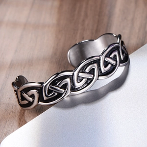 Macro shot of Viking Celtic knot pattern on vintage stainless steel cuff bracelet