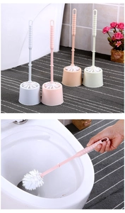 Detail showing colorful plastic toilet brush sets with holder in multiple vibrant colors