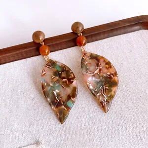 Leaf-shaped resin drop earrings with marble brown pattern and gold metal accents