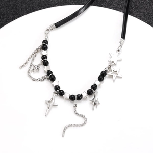 Detailed shot of gothic black beaded necklace with silver stars and rhinestone pendant