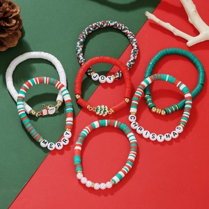 Close-up of 6-piece Christmas beaded bracelet set with Merry Joy letters and snowman charms