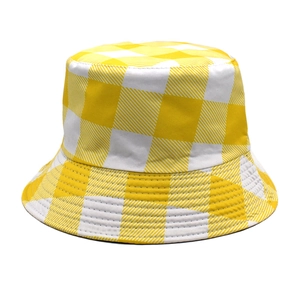Detailed view of yellow and white checkered bucket hat in durable twill cotton fabric