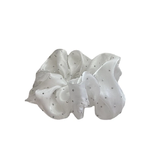 French vintage white satin scrunchie with sparkling rhinestones on a white background