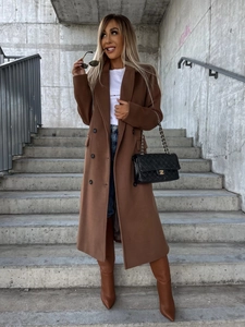 Detail of caramel wool coat with double-breasted buttons and classic lapel on model