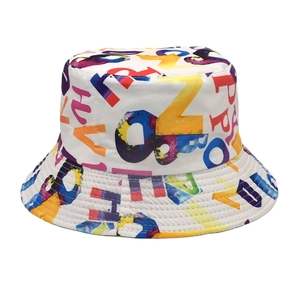 Detail of white cotton bucket hat featuring all-over colorful graffiti letter prints