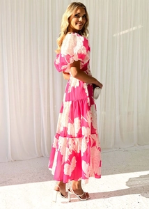 Detail of elegant pink floral puff sleeves and layered skirt on a summer dress