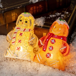 Illuminated Christmas snowman and gingerbread man figurines with LED sequins decor