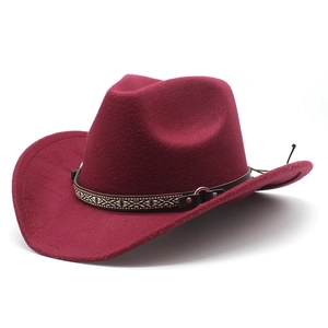 Detail of burgundy wool felt cowboy hat with ethnic style leather band and metal stud