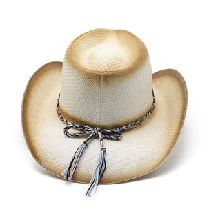 Detail of western straw cowboy hat with woven colorful tassel rope and gradient edges