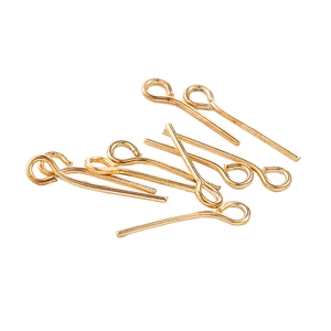 Gold plated DIY jewelry headpins and eye pins assortment on white background