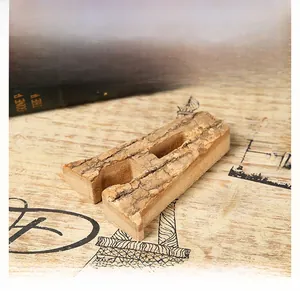Detail of a decorative wooden letter A with natural birch bark texture and rustic finish