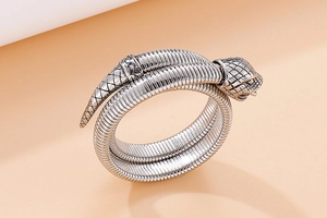 Macro detail of silver cobra snake ring showing scales texture and vintage steel finish