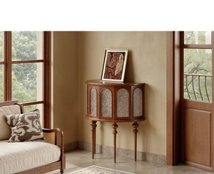 Detailed view of a semi-circular wooden cabinet with arched doors and textured panels