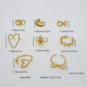 Detailed view of eight 18K gold plated ring designs with heart and infinity motifs