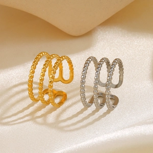 Three-layer beaded open ring in gold and silver finish on elegant silk background