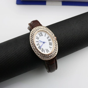 Elegant oval quartz watch for women with rhinestone bezel and brown leather strap