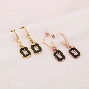 Elegant gold and rose gold geometric earrings with black enamel and zircon accents