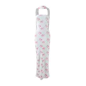 Close-up of pink rose floral print on white halter neck slim fit maxi dress
