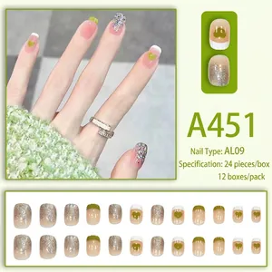 Pink and silver press-on nails with green heart design in a set of 24 short round pieces